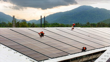 technician installs a large photovoltaic system on an industrial rooftop. ESG investment, and the...