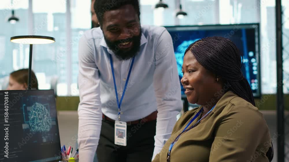 Poster happy engineers enjoying funny conversation at desk while using ai on computer to optimize performan
