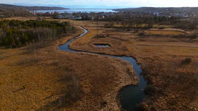 Aerial view of the upper course of the Wurm River from Starnberg to Leutstetten. The Leutstettener Moos nature reserve is located in the Leutstetten district of Starnberg, Upper Bavaria, Germany. 