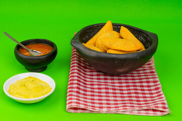 Colombian empanada with spicy sauce 
