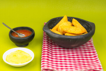 Delicious traditional Colombian empanadas with spicy sauce