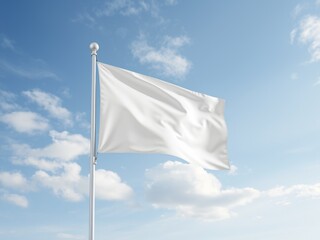A white flag waving gently against a backdrop of a bright blue sky dotted with fluffy white clouds