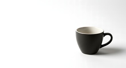 Obraz premium Simple Dark Ceramic Coffee Cup with White Interior Isolated on White Background Representing Morning Rituals and Cozy Moments