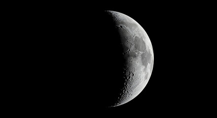 Detailed Waxing Gibbous Moon Phase with Visible Craters Against a Black Sky Background in High Resolution
