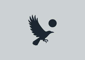 Fototapeta premium Flying crow silhouette logo for mystery, freedom, or bold branding.