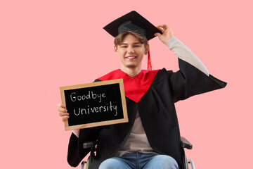 Male graduate in wheelchair holding chalkboard with text GOODBYE UNIVERSITY on pink background