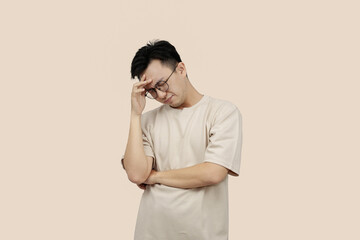 Frustrated young asian Man Expressing Anger With Aggressive Gesture in Casual Attire