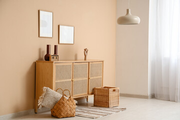 Interior of room with commode, frames and lamp