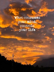 What consumes your mind controls your life with blurry sunset background. Stock photo.