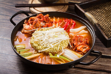 Korean Army Stew (Budae Jjigae) – Spicy Hot Pot with Sausage, Ham, Ramen Noodles, Kimchi, and Vegetables in a Red Chili Broth, A Fusion Comfort Food Inspired by U.S. Military Rations
