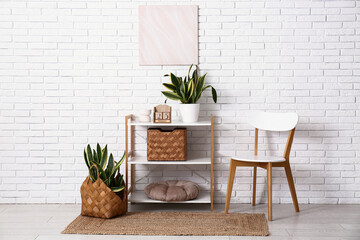 Interior of room with shelf unit, chair and cube calendar
