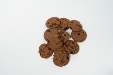 Pile of Delicious Chocolate Cookies with Chocolate Chips on White Background

