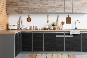 Interior of kitchen with counters, utensils and cube calendar
