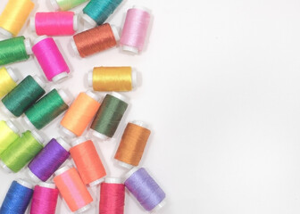 Colorful Thread Spools Top View with Copy Space on the Right
