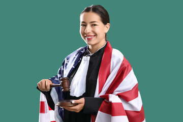 Female judge with USA flag and gavel on green background. Labor Day celebration