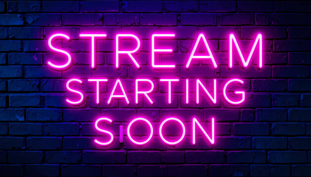 A neon sign on a brick wall that says stream starting soon in bright pink glowing letters on a dark background