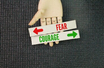 Two opposite words Direction Way to Courage vs Fear. Courage isn't the absence of fear, but rather...