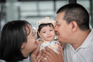 Joyful Family Moment Captured with Baby and Loving Parents Together