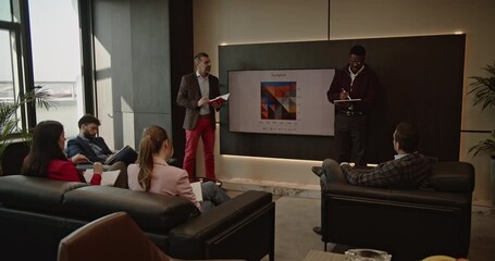 A multinational business team collaborates on a project, analyzing data and discussing growth strategies in a modern office. - Powered by Adobe