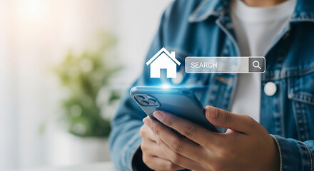 Person using smartphone to search for real estate online with house icon and search bar