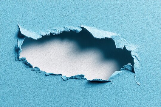 Torn blue backdrop with a gap for your promotional material Blank area for inserting an object Abstract horizontal image through paper