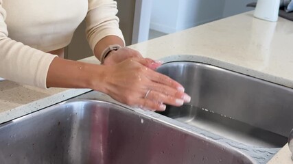 Thorough Hand Washing With Soap at Kitchen Sink