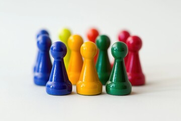 Data-driven segmentation metaphor, multicolored pawns arranged in clear clusters