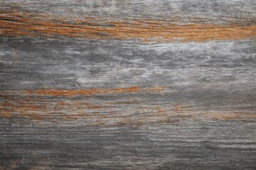 Abstract grey and brown wood textured background suitable for wallpapers screensavers brochures or presentations with space for text