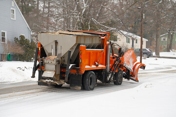 snowplow driving on residential street