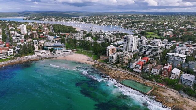Sydney, Australia: Panoramic drone video from above the cityscape and seascape at Cronulla with its string of beaches, and Bundeena beach, Port Hacking and Gunnamatta Bay in the background.