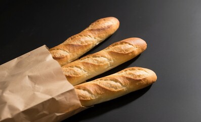 Freshly baked french baguettes in paper bag on black background for bakery shop promotion concept