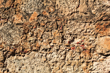 Photo of a rustic brown stone wall