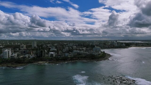 Cronulla, Sydney, Australia &ndash;UHD Drone Video- Spectacular nature and cityscape, flying over the surf along the Cronulla rocky shoreline and beaches, over Shark &lsquo;island&ndash;a small Rock Islet off the coast