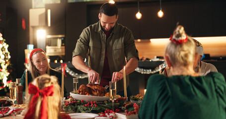 Smile, man and cutting turkey for Christmas celebration, dinner meal and social gathering. Happy,...