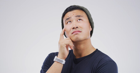 Thinking, planning and man in studio with uncertain for decision, brainstorming or question....