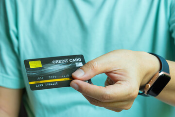 Woman holding several credit cards and he is choosing a credit card to pay and spend Payment for...