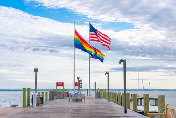 Cherry Grove with American and pride flags. Fire Island, New York State, United States of America.