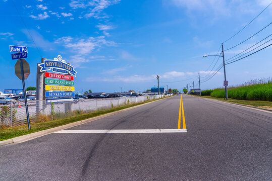  Sayville Ferry Service on River Road. View of the Signboard and parking. Sayville, New York State, United States of America.