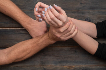 Hand restraint - control and resistance in one gesture, symbol of struggle of men and women, male...