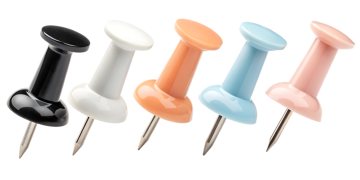 Close-up reveals a vibrant assortment of push pins against a dark backdrop, showcasing black, white, orange, blue, and pink colors, perfect for visualizing office supplies and organizational concepts,