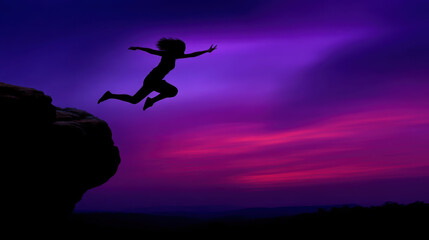 Silhouette of person jumping off cliff against vibrant purple and pink sunset sky, conveying freedom and adventure