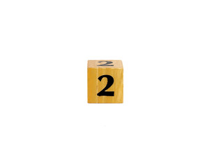 Wooden Number 2 Block Standing on Glossy Surface with Copy Space
