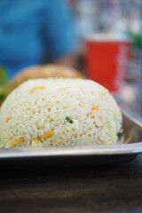 Delicious plate of fried rice served on a metal tray