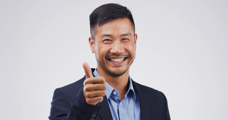 Happy man, portrait or thumbs up in studio for good job, success or OK on a white background. Face,...