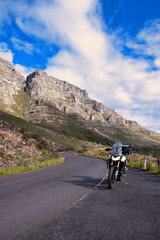Adventure Motorcycle on Mountain Road with Table Mountain and Platteklip Gorge
