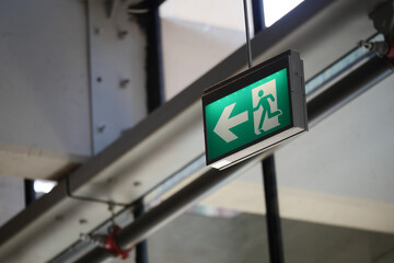 Emergency exit sign guiding pedestrians to safety