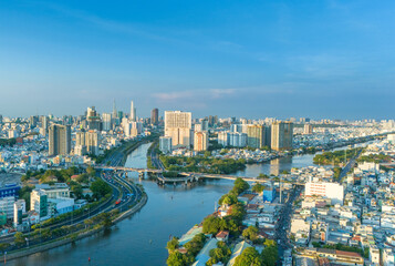 Obraz premium Panoramic view of Saigon, Vietnam from above at Ho Chi Minh City's central business district. Cityscape and many buildings, local houses, rivers. Landscape concept.