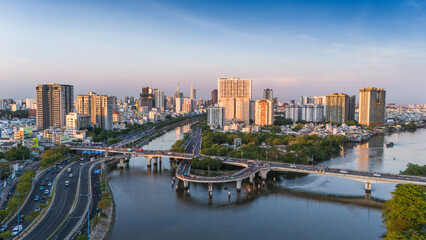 Fototapeta premium Panoramic view of Saigon, Vietnam from above at Ho Chi Minh City's central business district. Cityscape and many buildings, local houses, rivers. Landscape concept.