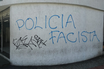 Graffiti protesting the police on a city wall in Brazil