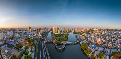 Obraz premium Panoramic view of Saigon, Vietnam from above at Ho Chi Minh City's central business district. Cityscape and many buildings, local houses, rivers. Landscape concept.